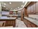 Spacious kitchen featuring granite countertops, stainless steel appliances, and ample cabinet space for storage at 10567 E Fernwood Ln, Scottsdale, AZ 85262