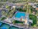 An aerial view reveals the community's sparkling pool, community center, and lush green grounds at 11216 E Appaloosa Pl, Scottsdale, AZ 85259