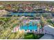 Overhead view of community pool, tennis courts, lush landscaping and residential area at 11216 E Appaloosa Pl, Scottsdale, AZ 85259