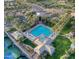 Bird's eye view of resort-style pool, clubhouse, and palm tree-lined grounds at 11216 E Appaloosa Pl, Scottsdale, AZ 85259