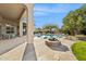 Inviting outdoor space with covered patio, sparkling pool, and stone fire pit, perfect for entertaining at 11216 E Appaloosa Pl, Scottsdale, AZ 85259