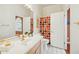 Bright bathroom featuring a vanity with sink, toilet, and colorful shower curtain at 11216 E Appaloosa Pl, Scottsdale, AZ 85259