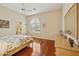 Bright bedroom with hardwood floors and a window at 11216 E Appaloosa Pl, Scottsdale, AZ 85259