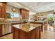 Stylish kitchen with granite countertops, a central island, stainless steel appliances, and custom cabinets at 11216 E Appaloosa Pl, Scottsdale, AZ 85259