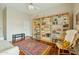 Comfortable living room with stylish bookshelves, rug, and hardwood floors at 11216 E Appaloosa Pl, Scottsdale, AZ 85259