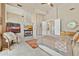 Spacious main bedroom featuring a fireplace, ceiling fan, and a walk-in closet at 11216 E Appaloosa Pl, Scottsdale, AZ 85259