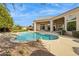 Inviting backyard pool area with mature landscaping, a built-in spa, and an expansive patio at 11216 E Appaloosa Pl, Scottsdale, AZ 85259