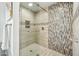 Modern bathroom shower featuring stylish tile work and glass door at 11216 E Appaloosa Pl, Scottsdale, AZ 85259