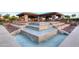 Multi-tiered water feature at the Community Center with covered pavilion and outdoor seating for residents at 11216 E Appaloosa Pl, Scottsdale, AZ 85259