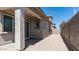 Backyard with covered patio area, low maintenance gravel landscaping, and block wall for enhanced privacy at 1193 E Spruce Dr, Chandler, AZ 85286