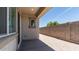 Covered patio transitions to a low-maintenance backyard with gravel landscaping and a block wall at 1193 E Spruce Dr, Chandler, AZ 85286