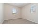 Carpeted bedroom with two windows providing natural light at 1193 E Spruce Dr, Chandler, AZ 85286