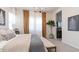 Bright bedroom showcasing neutral décor, chandelier, and access to an ensuite bathroom at 1193 E Spruce Dr, Chandler, AZ 85286