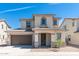 Charming two-story home featuring a covered entryway, neutral stucco, and a two-car garage at 1193 E Spruce Dr, Chandler, AZ 85286