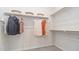 Spacious walk-in closet with ample storage, including shelves, rods, and overhead basket storage at 1193 E Spruce Dr, Chandler, AZ 85286