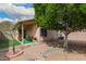 Spacious backyard featuring an outdoor seating, rocks, gravel, and a privacy fence, ideal for relaxation and entertainment at 121 N Ramada --, Mesa, AZ 85205