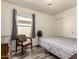 Cozy bedroom features updated flooring, neutral walls, and a sunlit window for a warm and inviting atmosphere at 121 N Ramada --, Mesa, AZ 85205