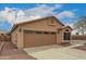 Charming single-story home featuring a two-car garage and low maintenance desert landscaping at 121 N Ramada --, Mesa, AZ 85205