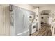 Well-lit kitchen with gray cabinets, white appliances, and hard surface floor at 121 N Ramada --, Mesa, AZ 85205