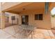 Back patio features a dining table and chairs at 14450 N 132Nd Dr, Surprise, AZ 85379