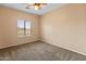 Bedroom featuring neutral walls and a large window at 14450 N 132Nd Dr, Surprise, AZ 85379