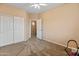 Clean bedroom with closet and adjoining door and neutral color scheme at 14450 N 132Nd Dr, Surprise, AZ 85379