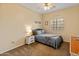 Cozy bedroom featuring a comfortable bed, nightstand, and ample natural light at 14450 N 132Nd Dr, Surprise, AZ 85379