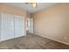 Comfortable bedroom features carpeted flooring, closet, and adjoined door at 14450 N 132Nd Dr, Surprise, AZ 85379