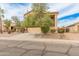 Charming tan two-story home with desert landscaping, stone accents, and a two-car garage at 14450 N 132Nd Dr, Surprise, AZ 85379