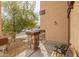 Charming front porch with stone detailing and a cozy bench, creating a welcoming outdoor space at 14450 N 132Nd Dr, Surprise, AZ 85379