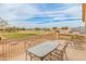 Outdoor patio with a dining table and chairs offering views of the green space and the neighborhood at 14450 N 132Nd Dr, Surprise, AZ 85379