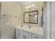 Stylish bathroom with white cabinetry, quartz counters, and modern fixtures at 16157 W Moreland St, Goodyear, AZ 85338