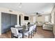 Open concept dining area with seating for six, seamlessly connected to the living space, ideal for gatherings at 16157 W Moreland St, Goodyear, AZ 85338