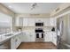 Bright kitchen with stainless steel appliances, modern cabinets, ample counter space, and a sink with window views at 16157 W Moreland St, Goodyear, AZ 85338