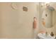 Charming powder room featuring a stylish round mirror and cute decor at 16157 W Moreland St, Goodyear, AZ 85338