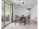 Bright dining area with modern table and chairs, complemented by sliding glass doors at 17810 W Straight Arrow Ln, Surprise, AZ 85387