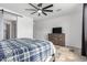 Comfortable main bedroom with neutral walls, ceiling fan, and coordinated furniture at 17810 W Straight Arrow Ln, Surprise, AZ 85387