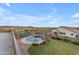 Expansive aerial view of the backyard, featuring a pool, spa, fire pit, and lush greenery with desert views at 18187 E Via Jardin --, Gold Canyon, AZ 85118