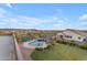 Expansive aerial view of a backyard oasis with a pool, spa, fire pit, and lush landscaping at 18187 E Via Jardin --, Gold Canyon, AZ 85118