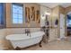 Bathroom featuring a soaking tub, granite counters, dual sinks and decorative mirrors at 18187 E Via Jardin --, Gold Canyon, AZ 85118