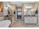 Bright bathroom with dual vanities, granite counters, and a view to the bedroom at 18187 E Via Jardin --, Gold Canyon, AZ 85118