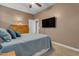 Cozy bedroom with a dresser, wall-mounted TV, and neutral color scheme at 18187 E Via Jardin --, Gold Canyon, AZ 85118