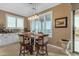 The well-lit dining area has shutters, a decorative table, and bar seating for casual meals and entertaining at 18187 E Via Jardin --, Gold Canyon, AZ 85118