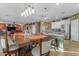 An expansive dining area is showcased with a large table, adjacent to the kitchen, inviting Gathering gatherings at 18187 E Via Jardin --, Gold Canyon, AZ 85118