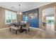 Bright dining room with large windows, blue accent wall, and elegant decor at 18187 E Via Jardin --, Gold Canyon, AZ 85118