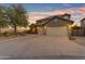 Beautiful home featuring desert landscaping and a spacious three-car garage at 18187 E Via Jardin --, Gold Canyon, AZ 85118