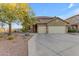 Inviting home featuring desert landscaping and a three-car garage at 18187 E Via Jardin --, Gold Canyon, AZ 85118