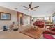 Open-concept living room showcases red leather furniture and easy access to adjacent spaces for seamless entertaining at 18187 E Via Jardin --, Gold Canyon, AZ 85118