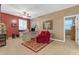 Office space featuring a red accent wall, large desk, and decorative rug at 18187 E Via Jardin --, Gold Canyon, AZ 85118