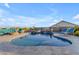 Beautiful backyard pool with a serene waterfall feature, surrounded by comfortable seating and a cozy fire pit at 18187 E Via Jardin --, Gold Canyon, AZ 85118